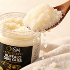 Close-up of white Phulka Buffalo Desi Ghee on a wooden spoon
