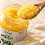 Close-up of golden Phulka Cow Desi Ghee on a wooden spoon