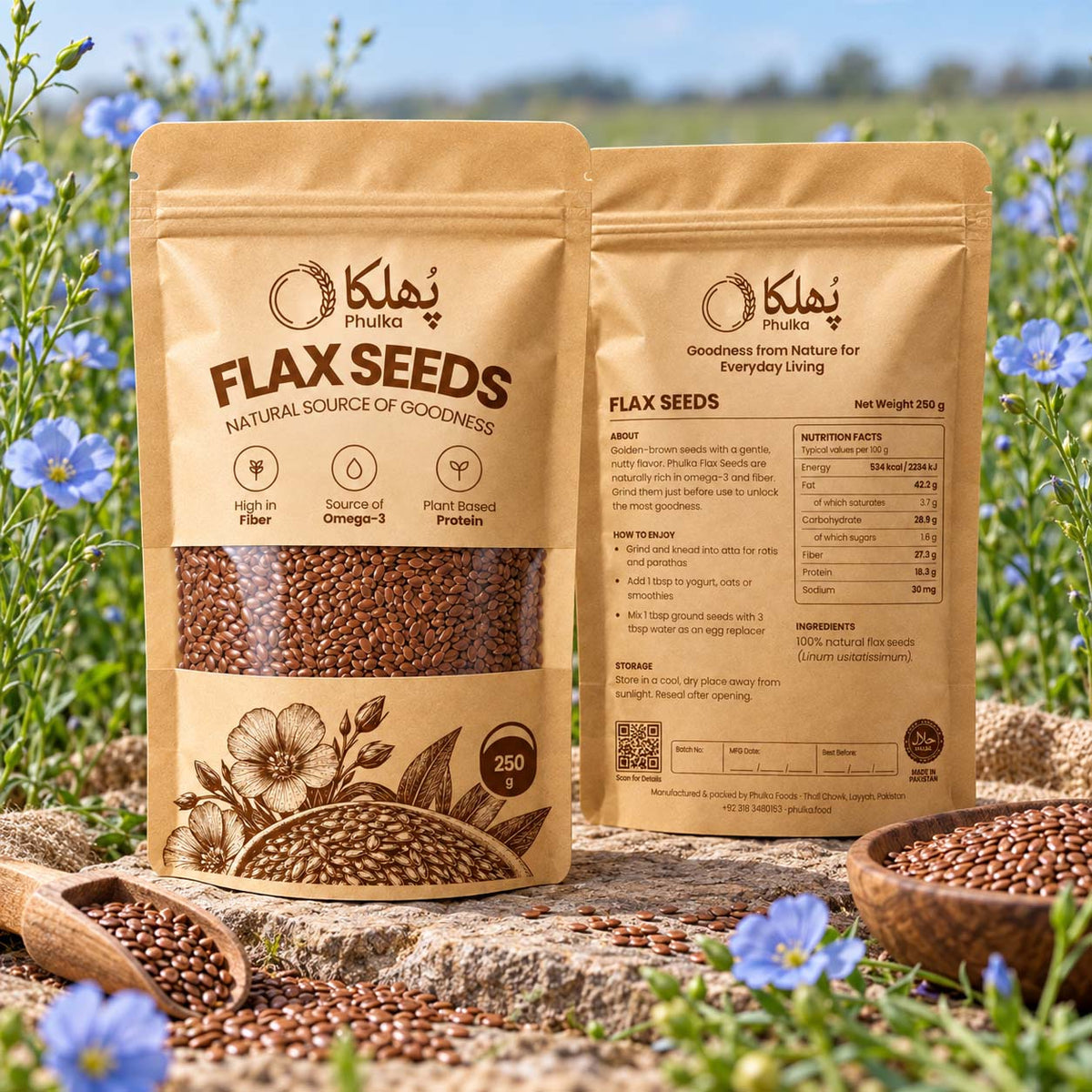 Phulka Flax Seeds pouches among blue flax flowers with a bowl and scoop of seeds